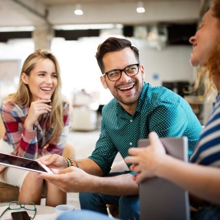 Business people, designers having fun and chatting at workplace office
